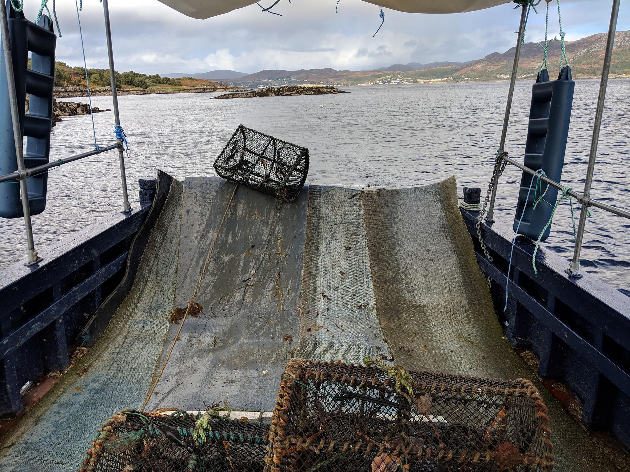 The pots are dragged off the back of the boat and dropped back into the water (Emma Henderson)