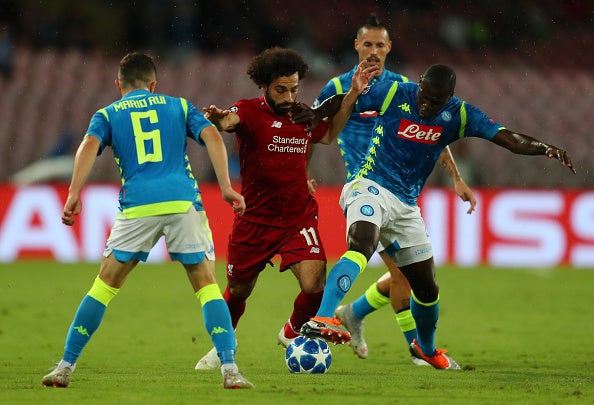 Salah crowded out of possession by Napoli's defenders