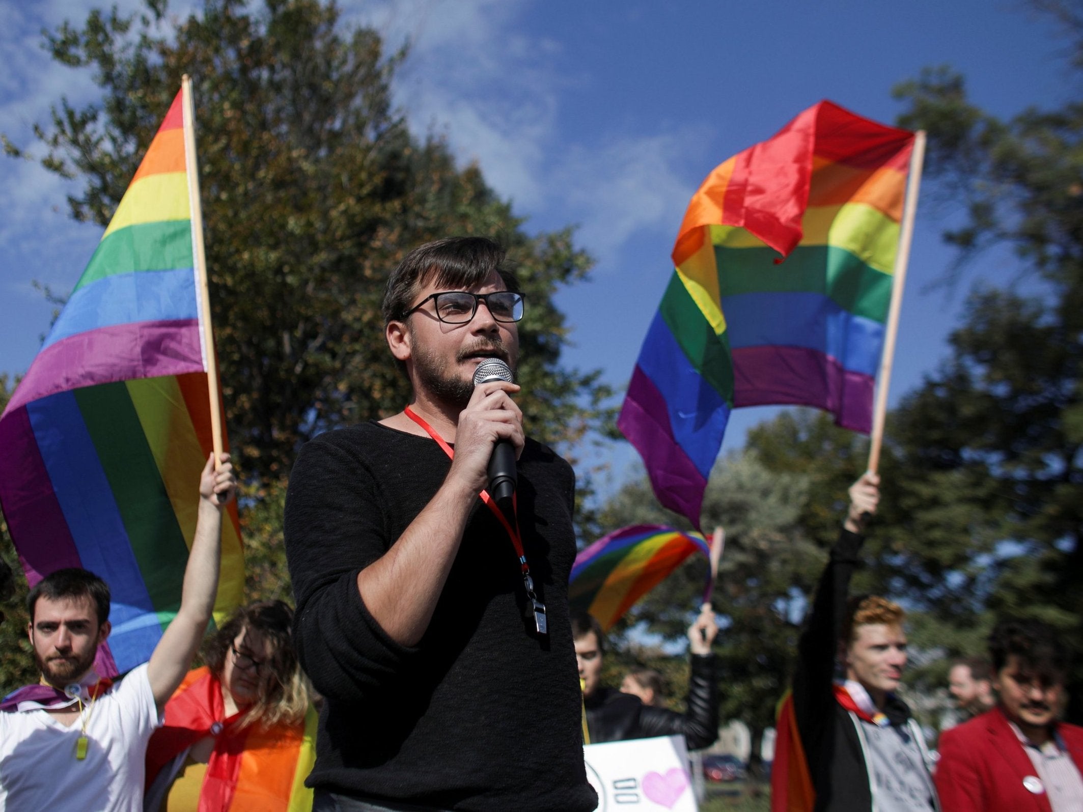 Vlad Viski of LGBT+ rights group Mozaiq delivers a speech during a protest against the referendum in Bucharest, Romania