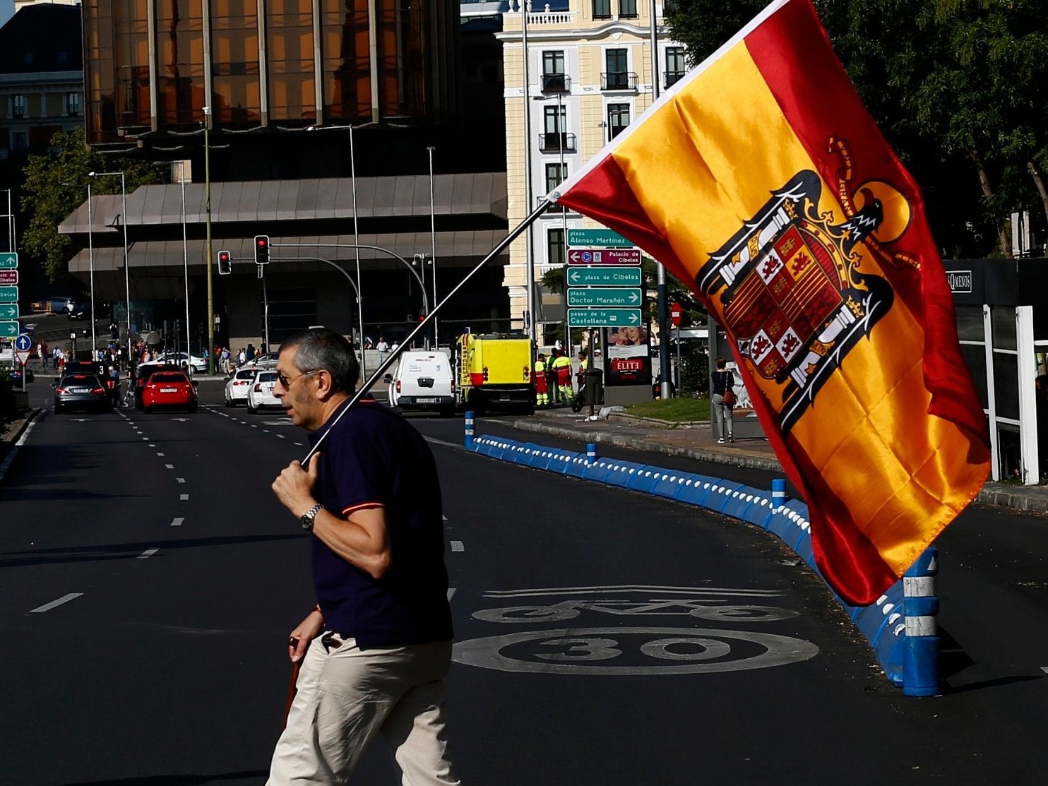 Protester holds Franco-era Spanish flag at Saturday's rally in Madrid