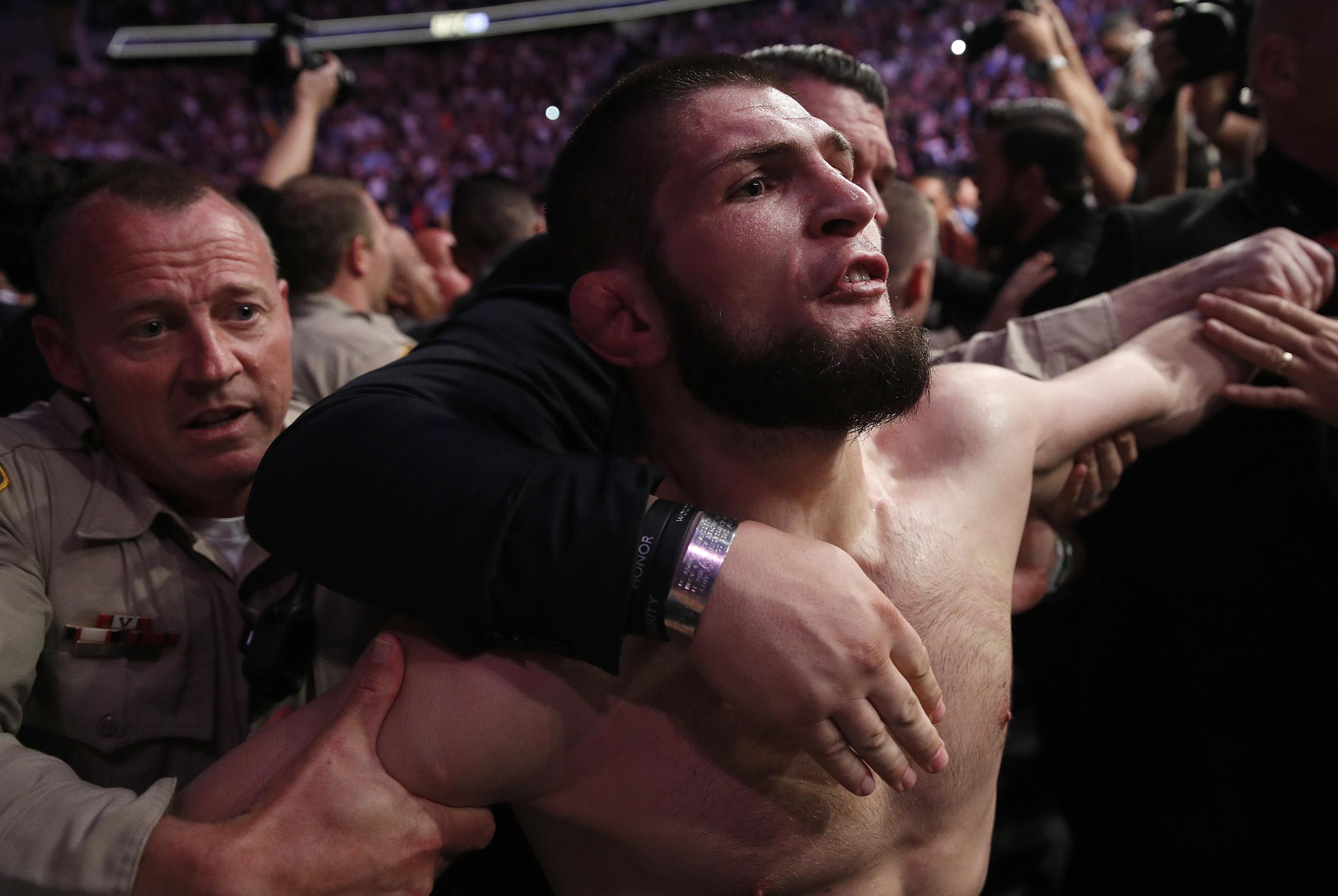 Khabib leaped into the crowd to attack one of McGregor's teammates