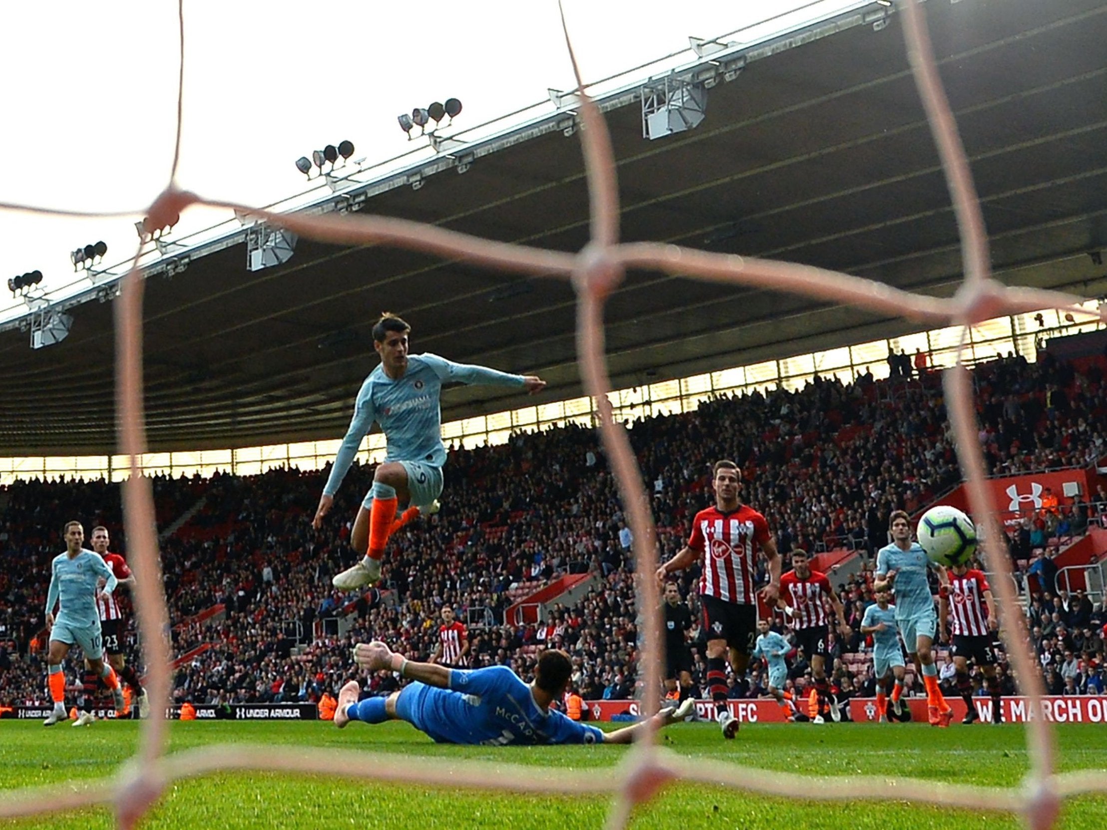 Alvaro Morata dinks the ball over Alex McCarthy