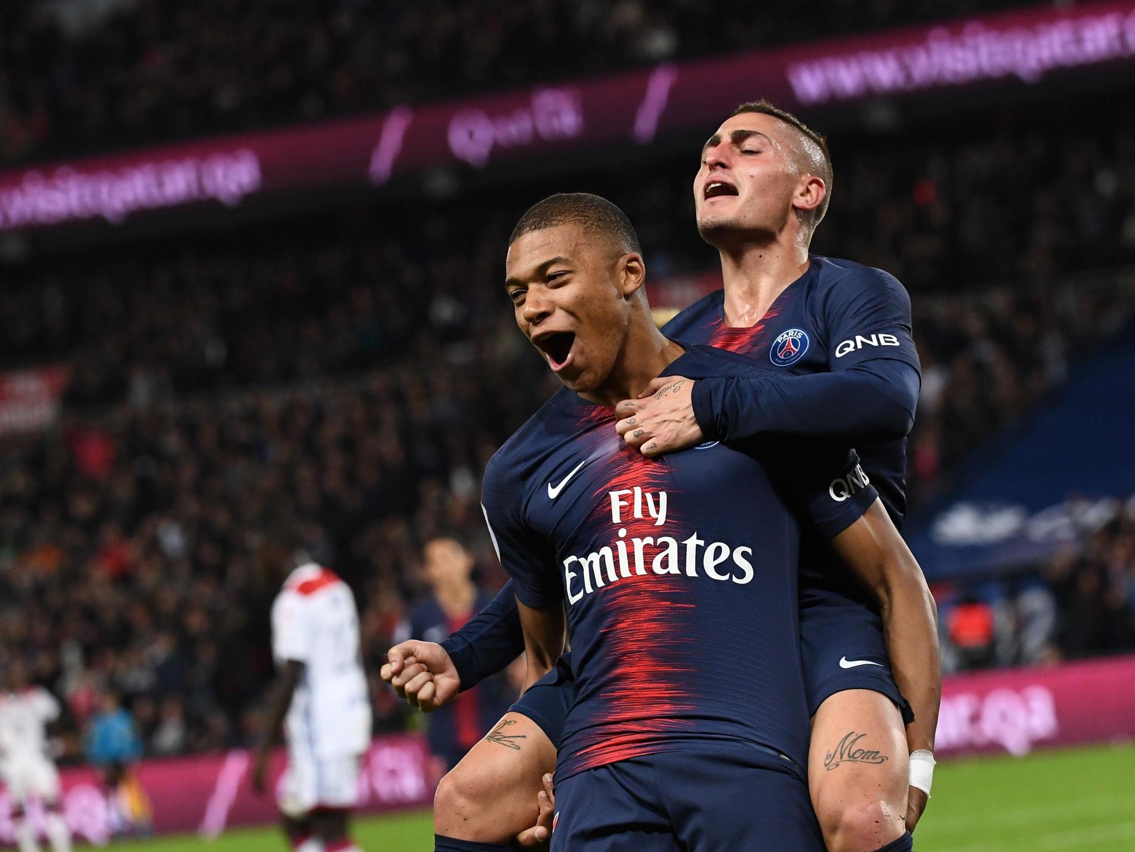 Kylian Mbappe celebrates scoring with teammate Marco Verratti