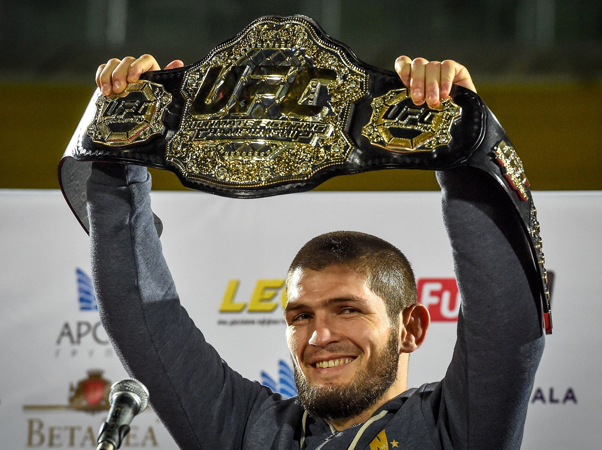 Khabib with his belt after returning to Russia