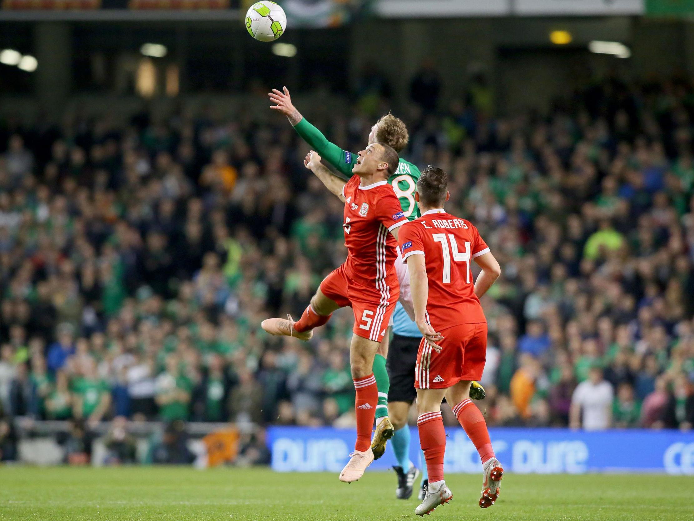 James Chester and Aiden O’Brien challenge for a high ball