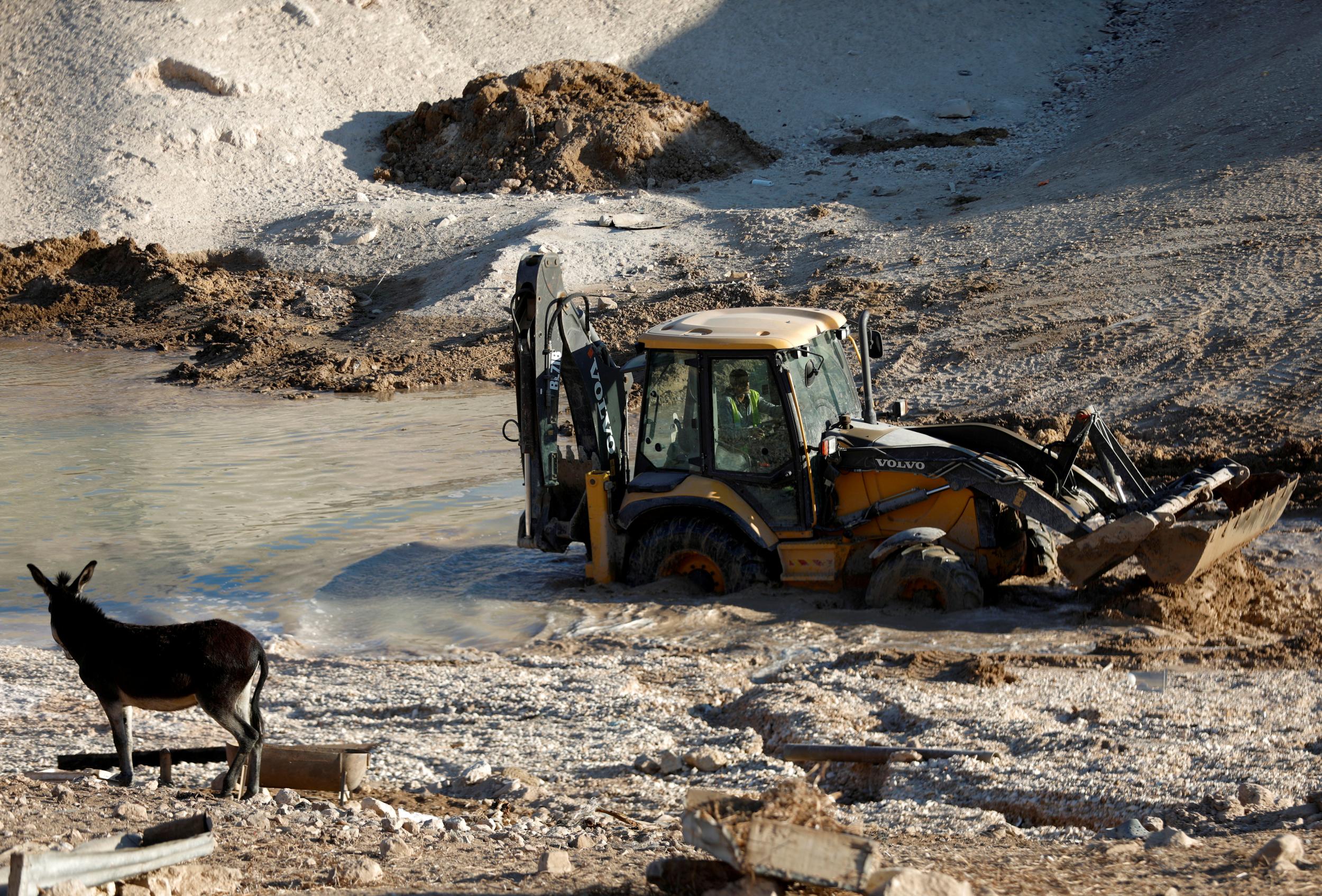 An Israeli bulldozer works on a wastewater pond in Khan al-Ahmar last month (Reuters/Mohamad Torokman)