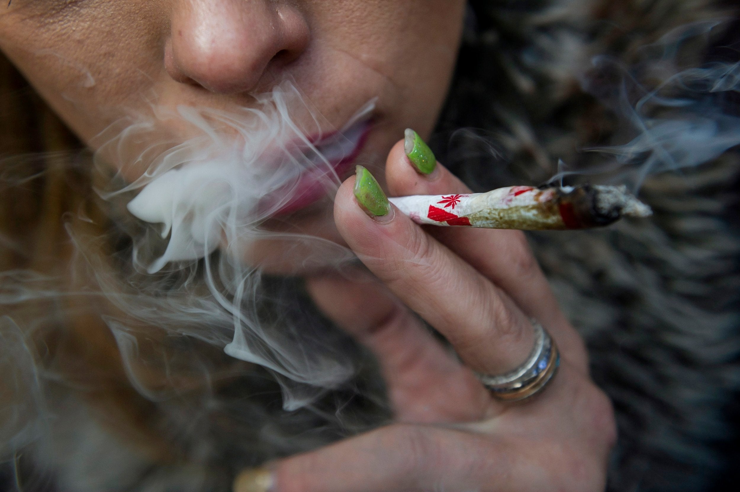 Woman smokes joint at 'Wake and Bake' festival in Toronto