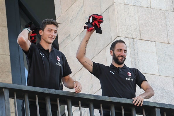 Gonzalo Higuain and Mattia Caldara are introduced to AC Milan fans