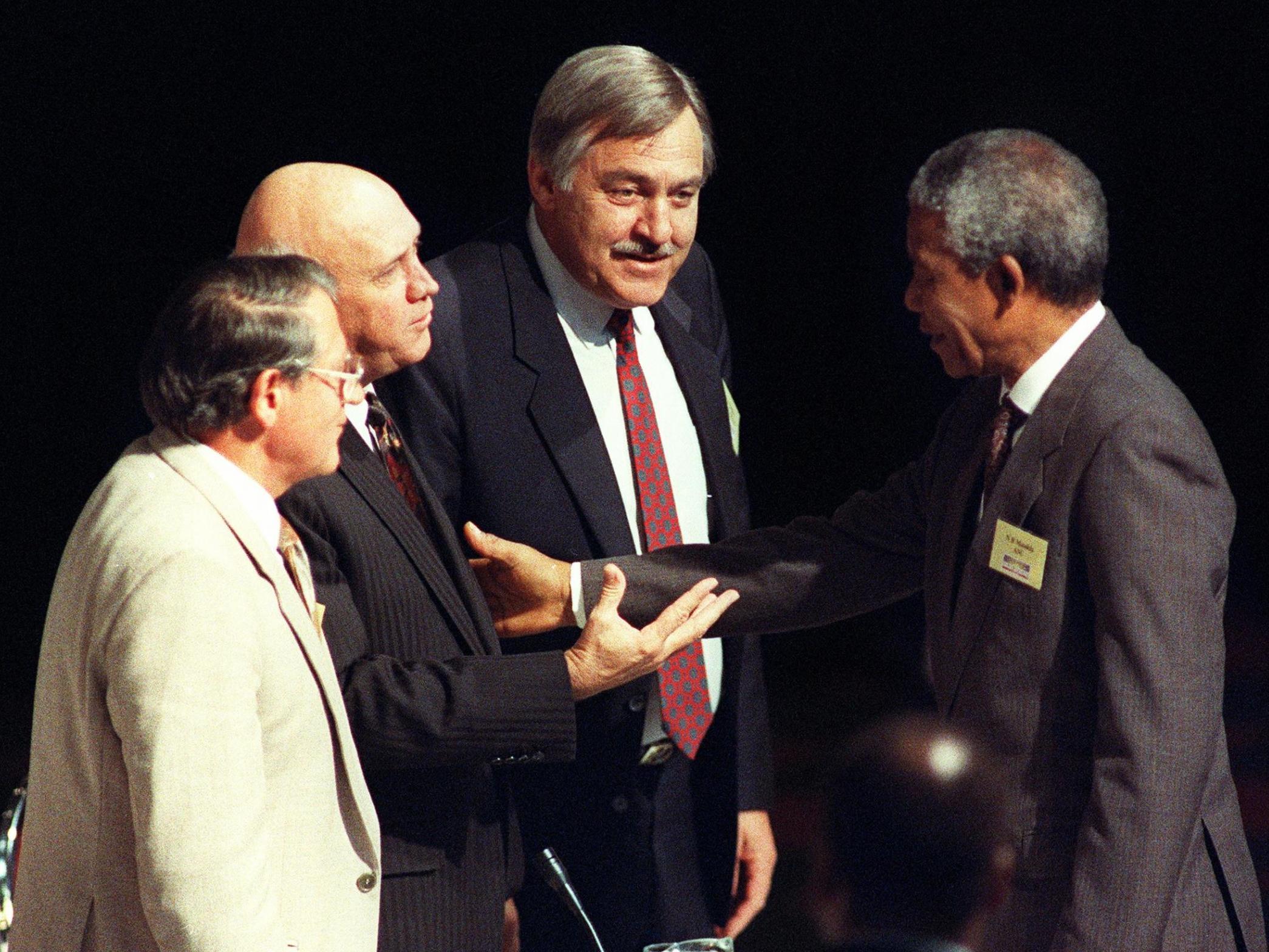 Middle man: Pik Botha between Nelson Mandela and FW De Klerk at the Convention for a Democratic South Africa in Johannesburg in 1992