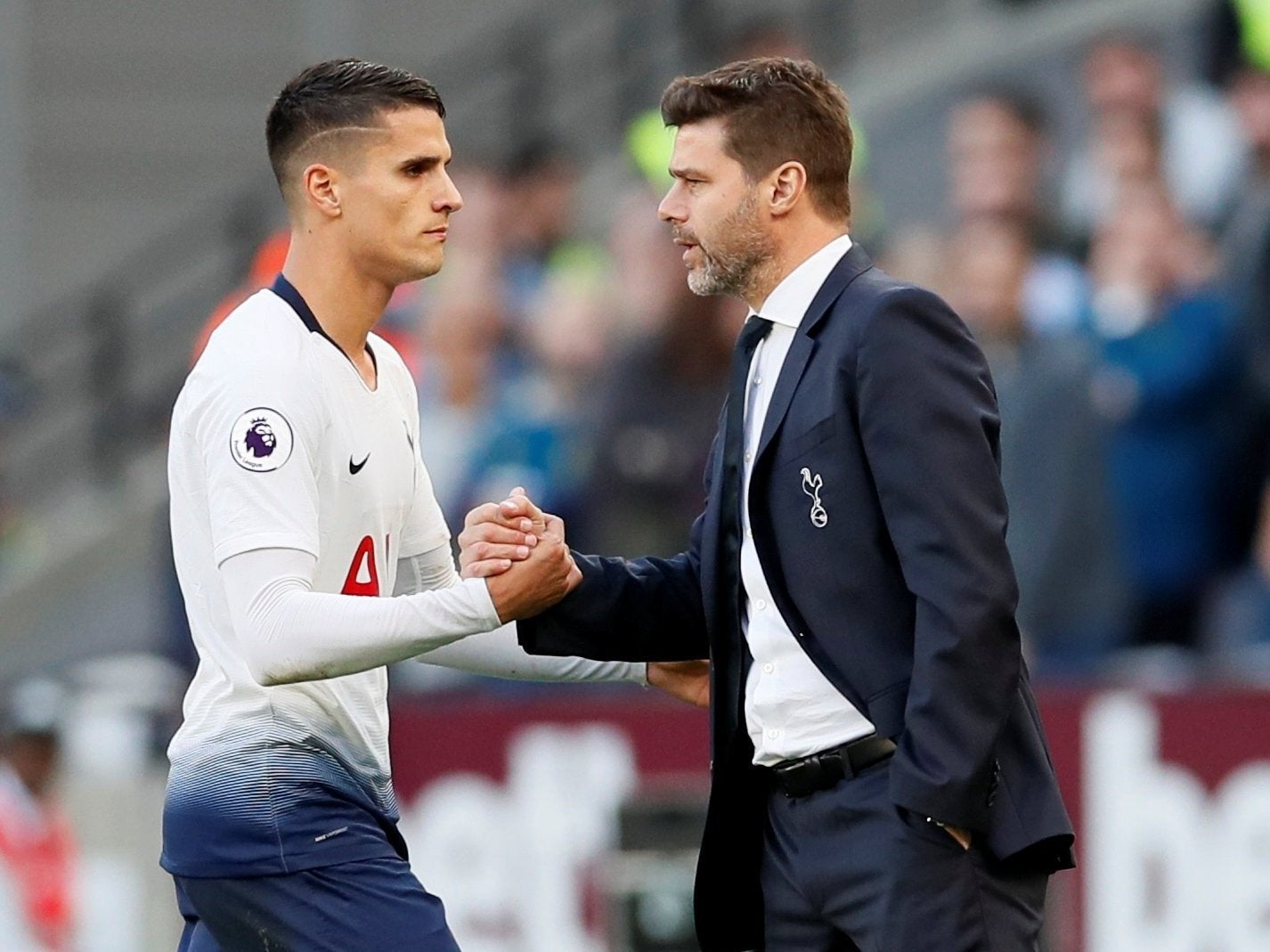 Erik Lamela is congratulated by Spurs boss Mauricio Pochettino