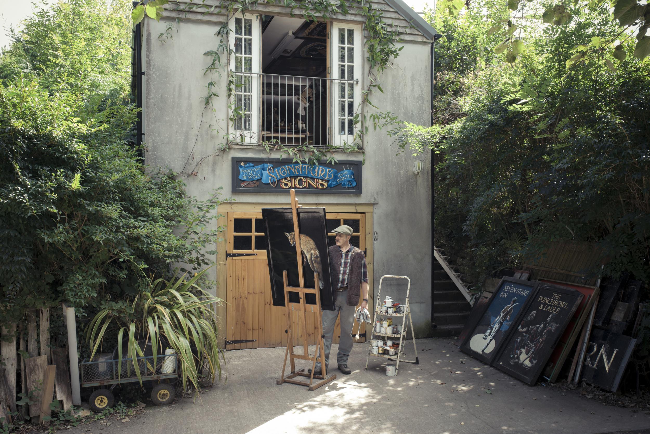 Sign painter Andrew Grundon