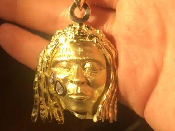 A gold pendant depicting US rapper Lil Wayne