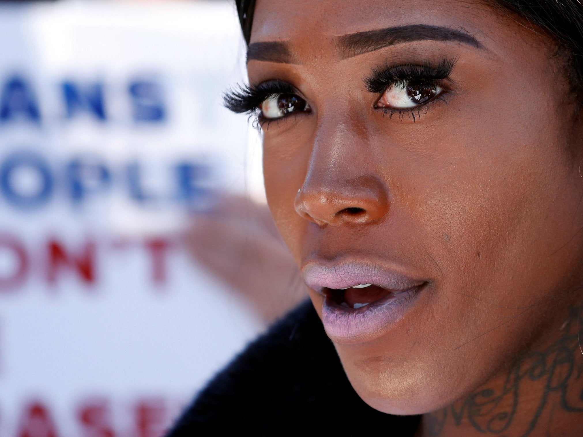 A Transgender rights activist protests the government's alleged attempt to strip transgender people of official recognition at the White House in Washington, U.S., 22 October 2018. REUTERS/Cathal McNaughton