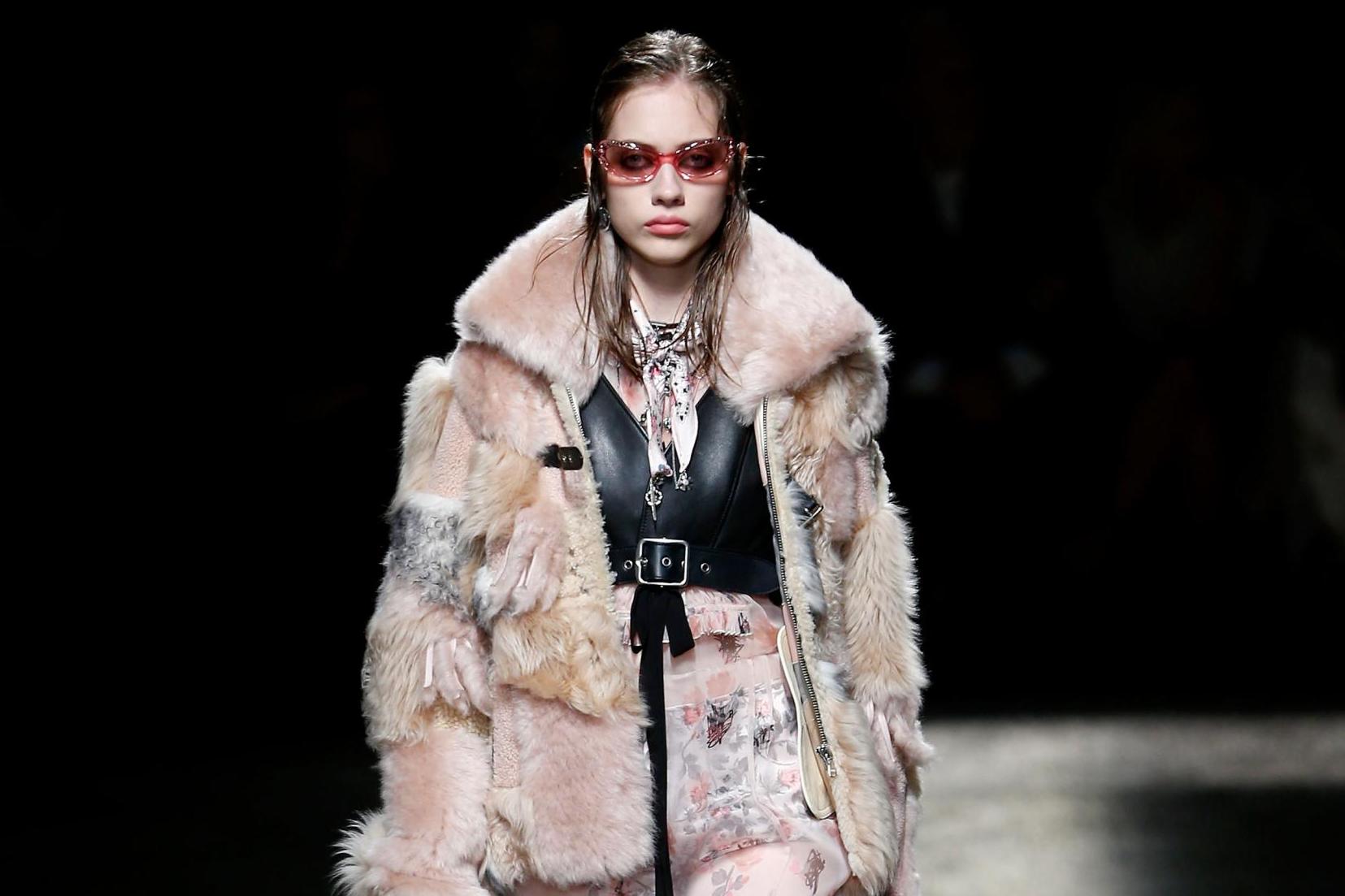 A model walks the runway at Coach fashion show at Pier 76 during September 2016 New York Fashion Week