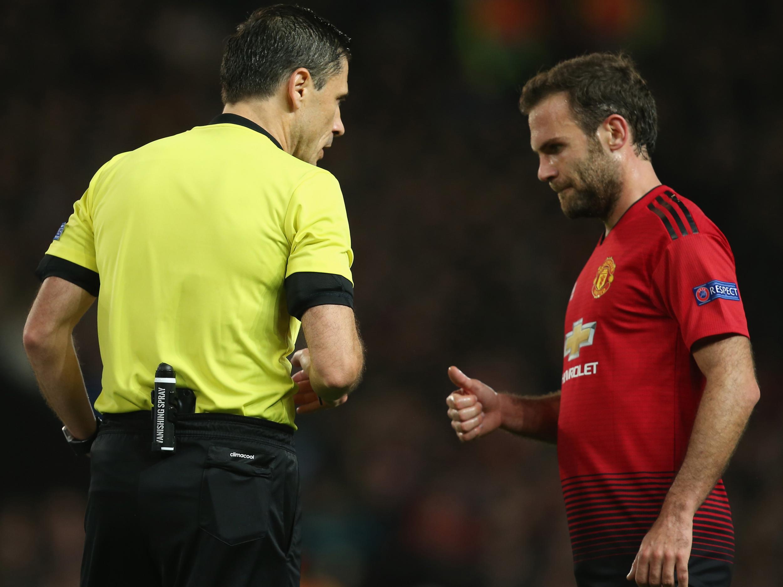 Juan Mata in conversation with the referee