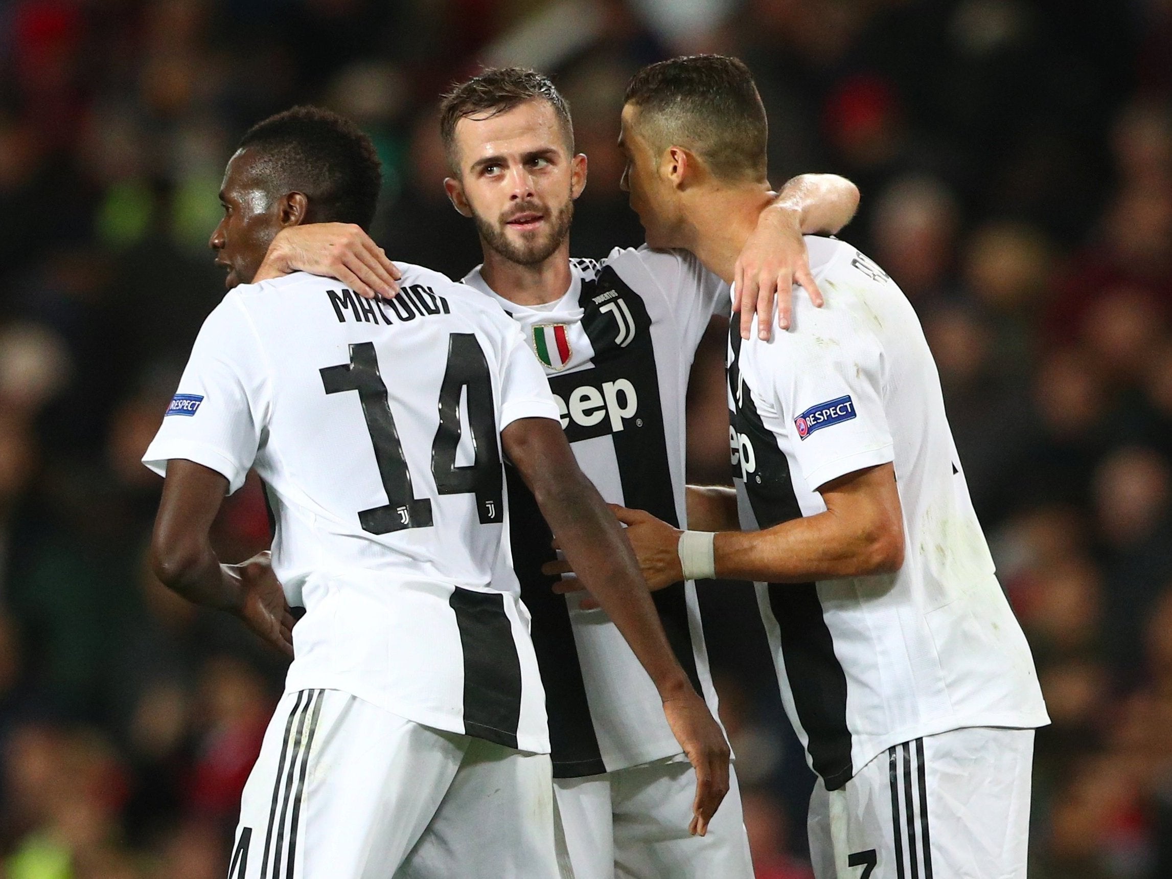 Miralem Pjanic celebrates Juventus's first goal with his teammates