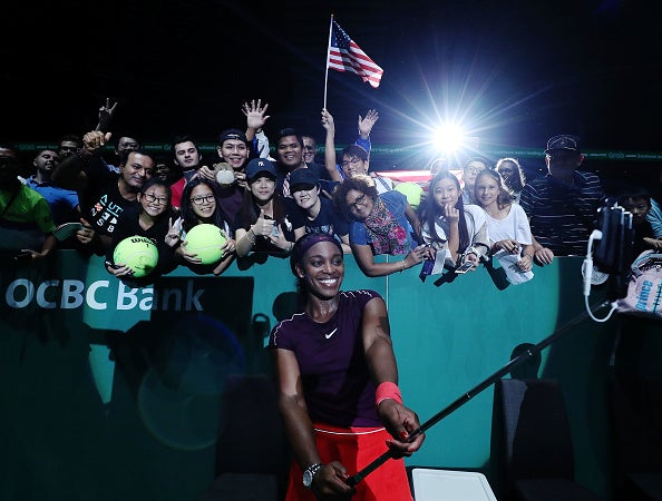 Sloane Stephens takes selfies with fans after her second win in Singapore