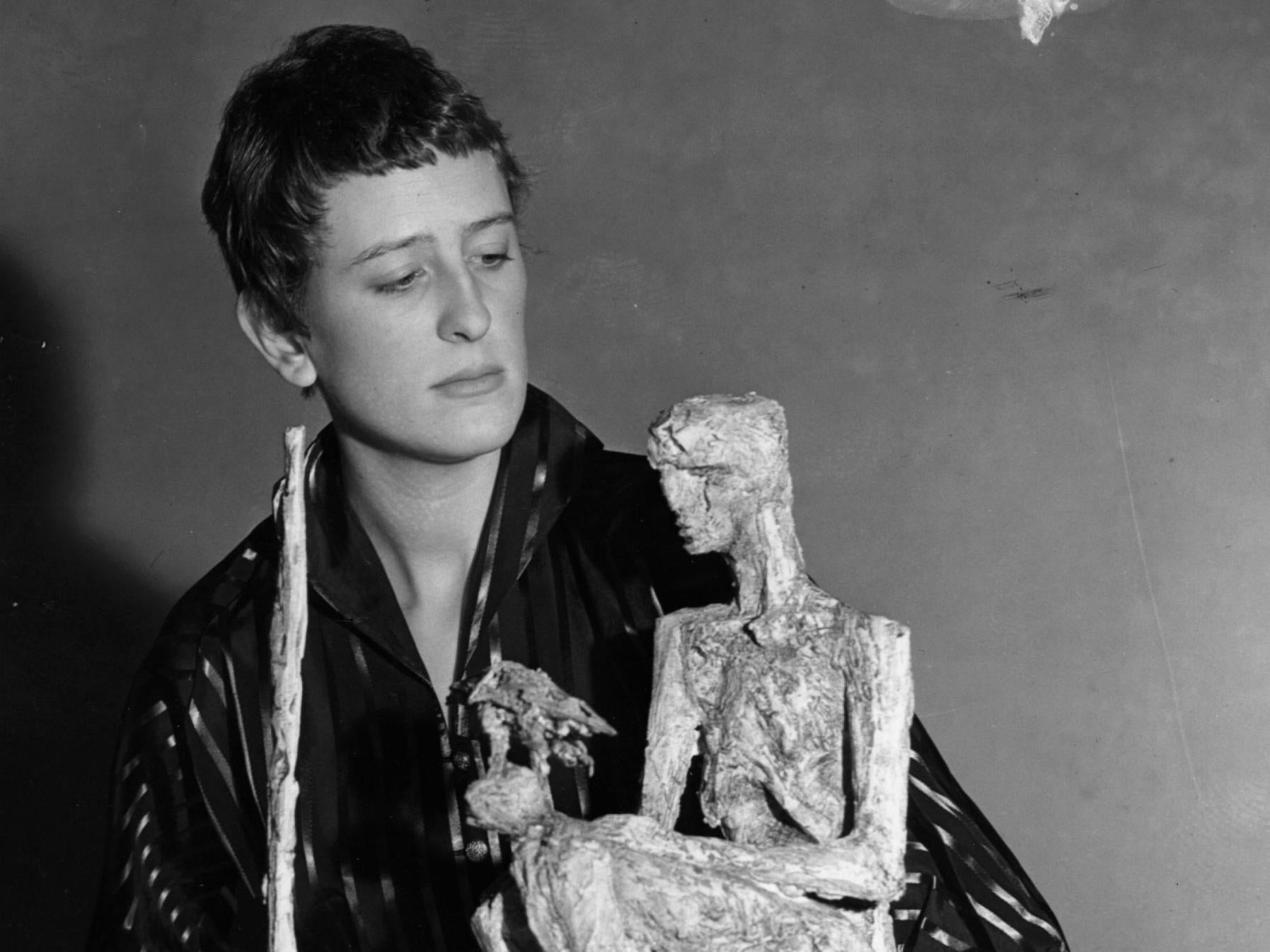 Frink with ‘The Unknown Political Prisoner’, her maquette chosen to represent Great Britain in the International Sculpture Competition of 1953