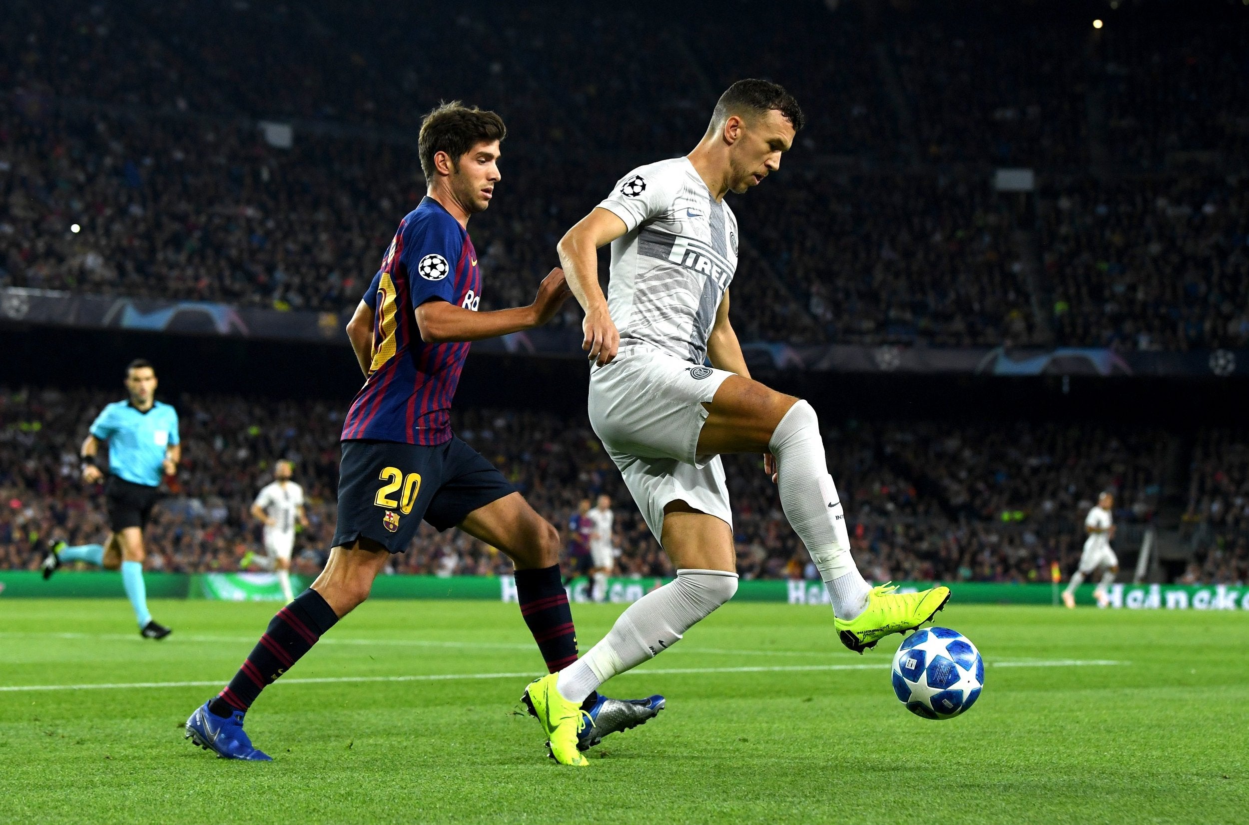 Ivan Perisic is marshalled by Sergi Roberto