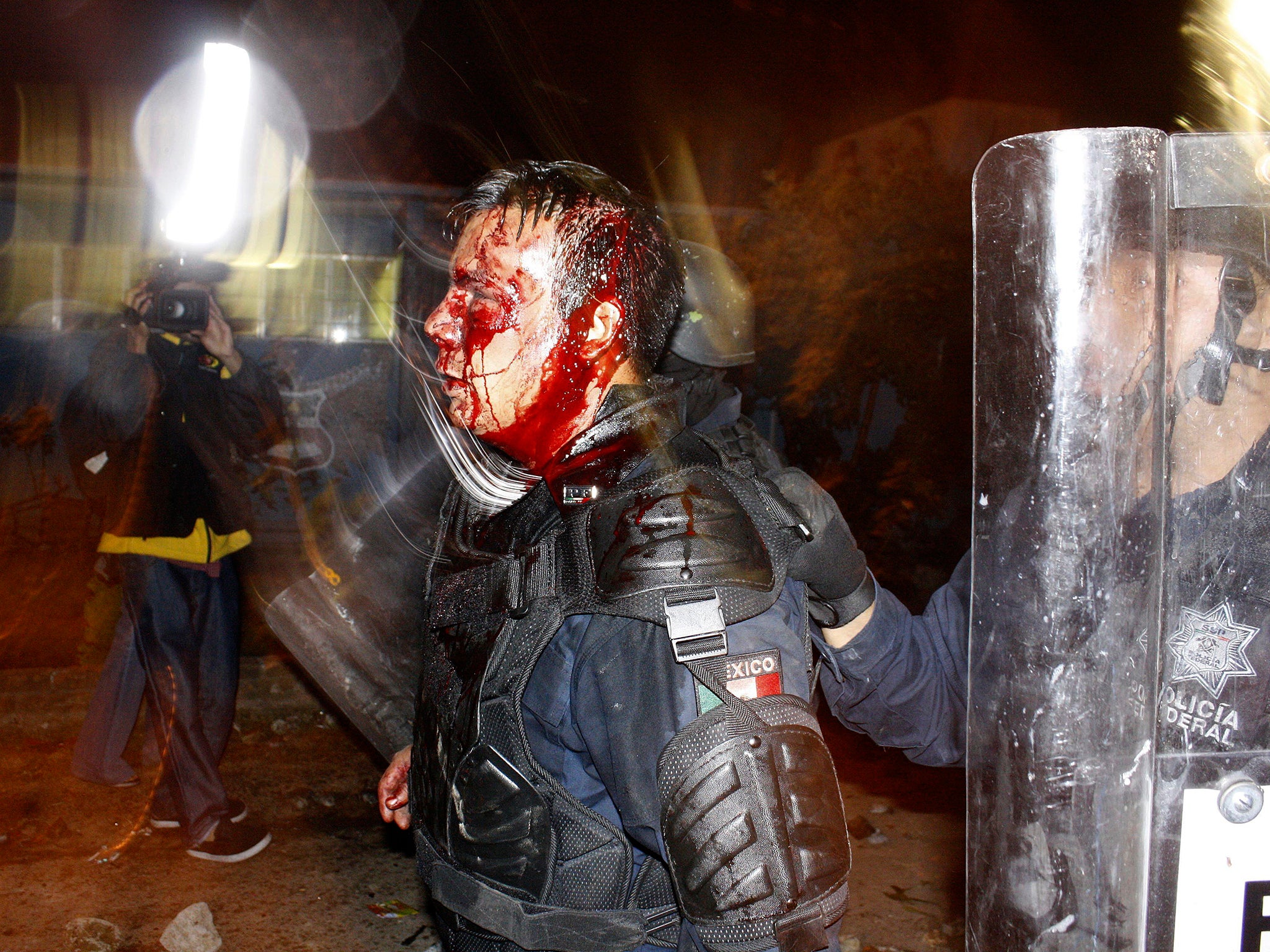 This photo shows a Mexican police officer who was injured in 2012 during a riot involving students at a school – but was used to spread fear about the so-called migrant caravan heading towards the US