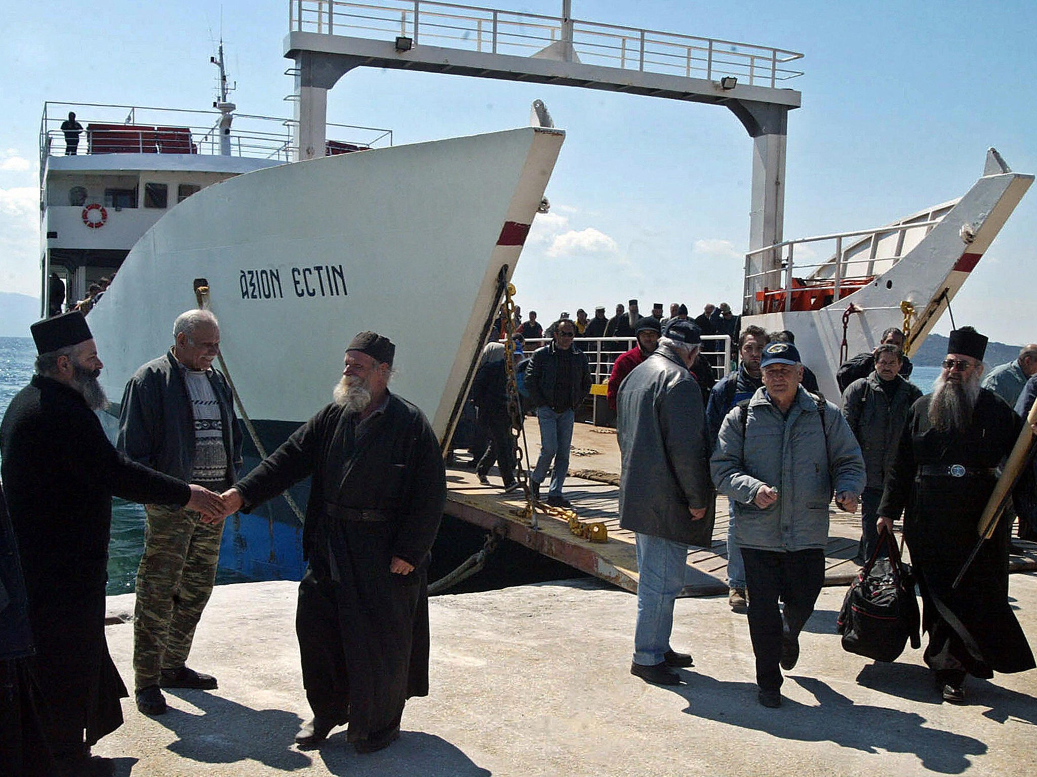 Monks and visitors alike reach Mount Athos on public ferries