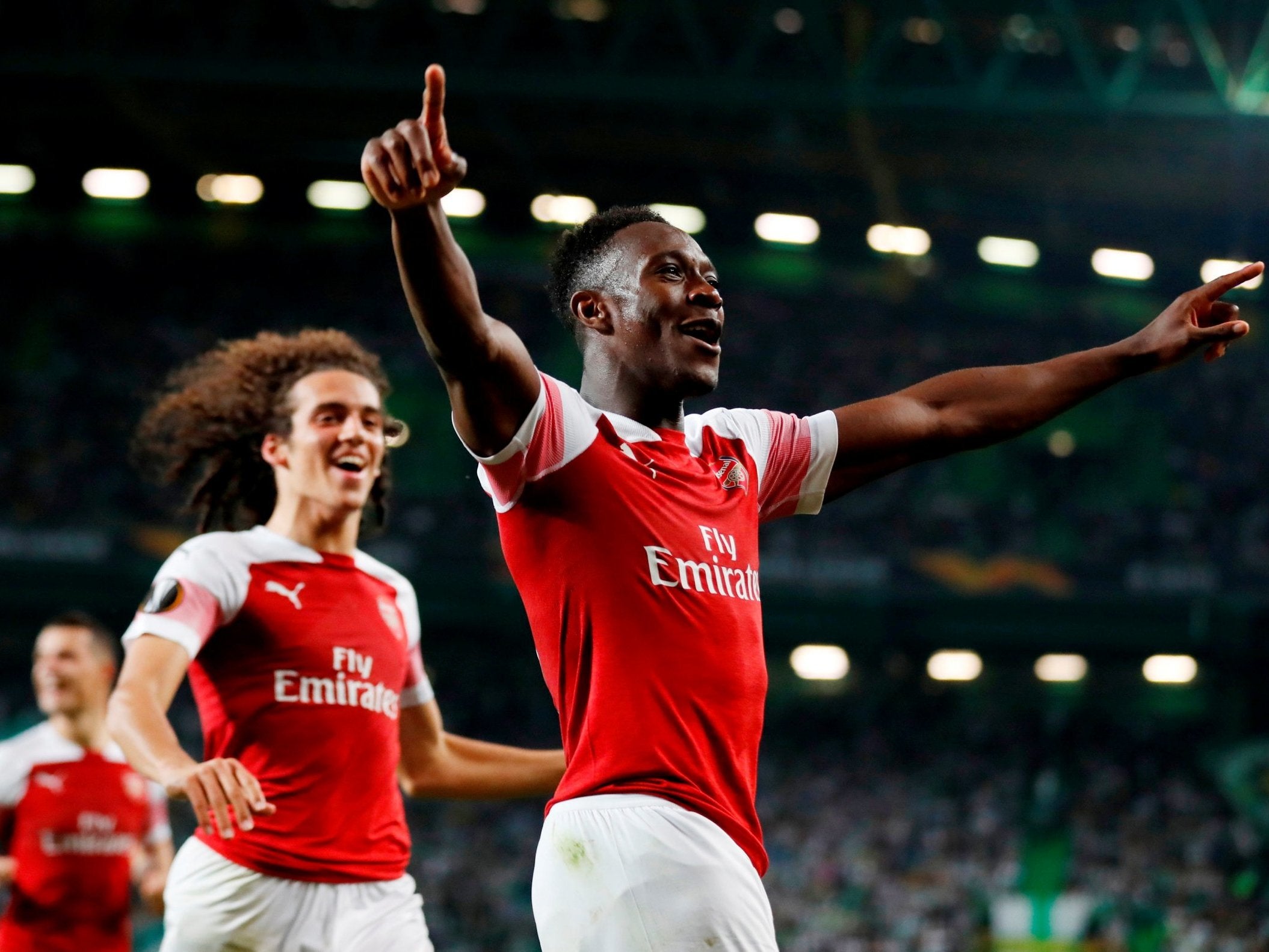 Danny Welbeck celebrates hitting the winning goal in Lisbon