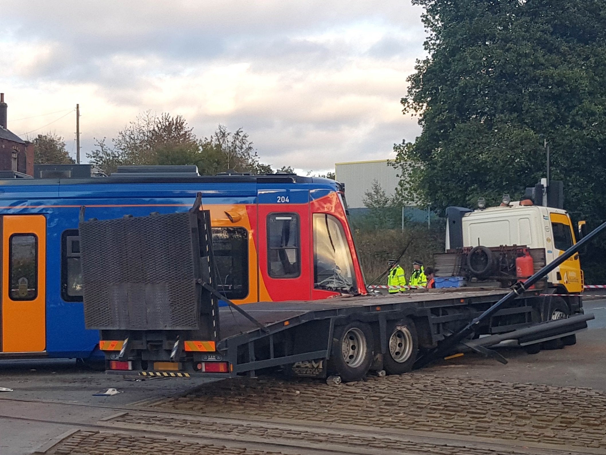 Emergency services at the scene in Staniforth Road, Sheffield, where a tram collided with a lorry