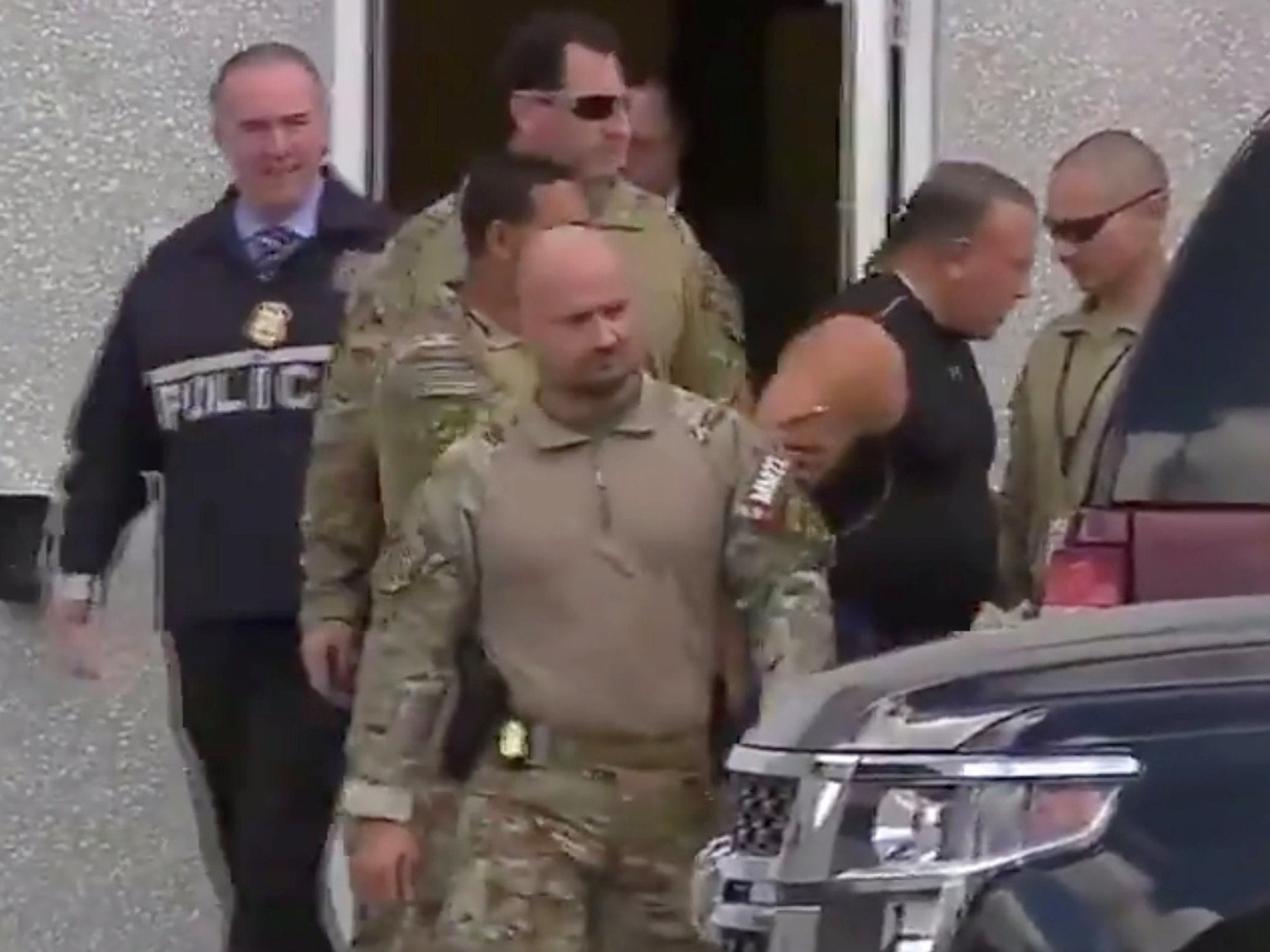 Cesar Sayoc is escorted from an FBI facility in Miramar, Florida (Reuters)