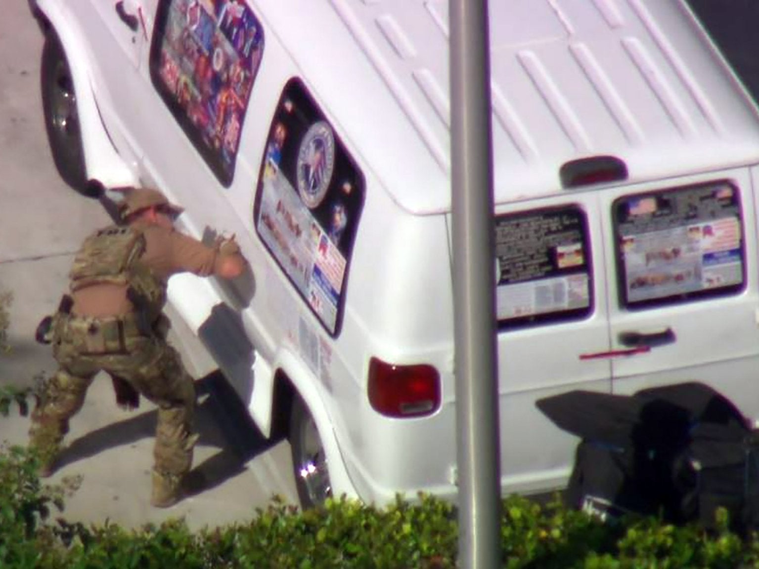 An FBI agent investigates the van believed to belong to Cesar Syoc (AFP/Getty)