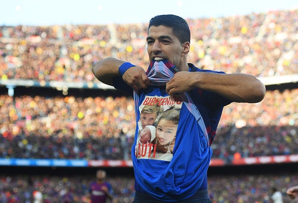 Suarez celebrates after scoring Barcelona's second from the spot