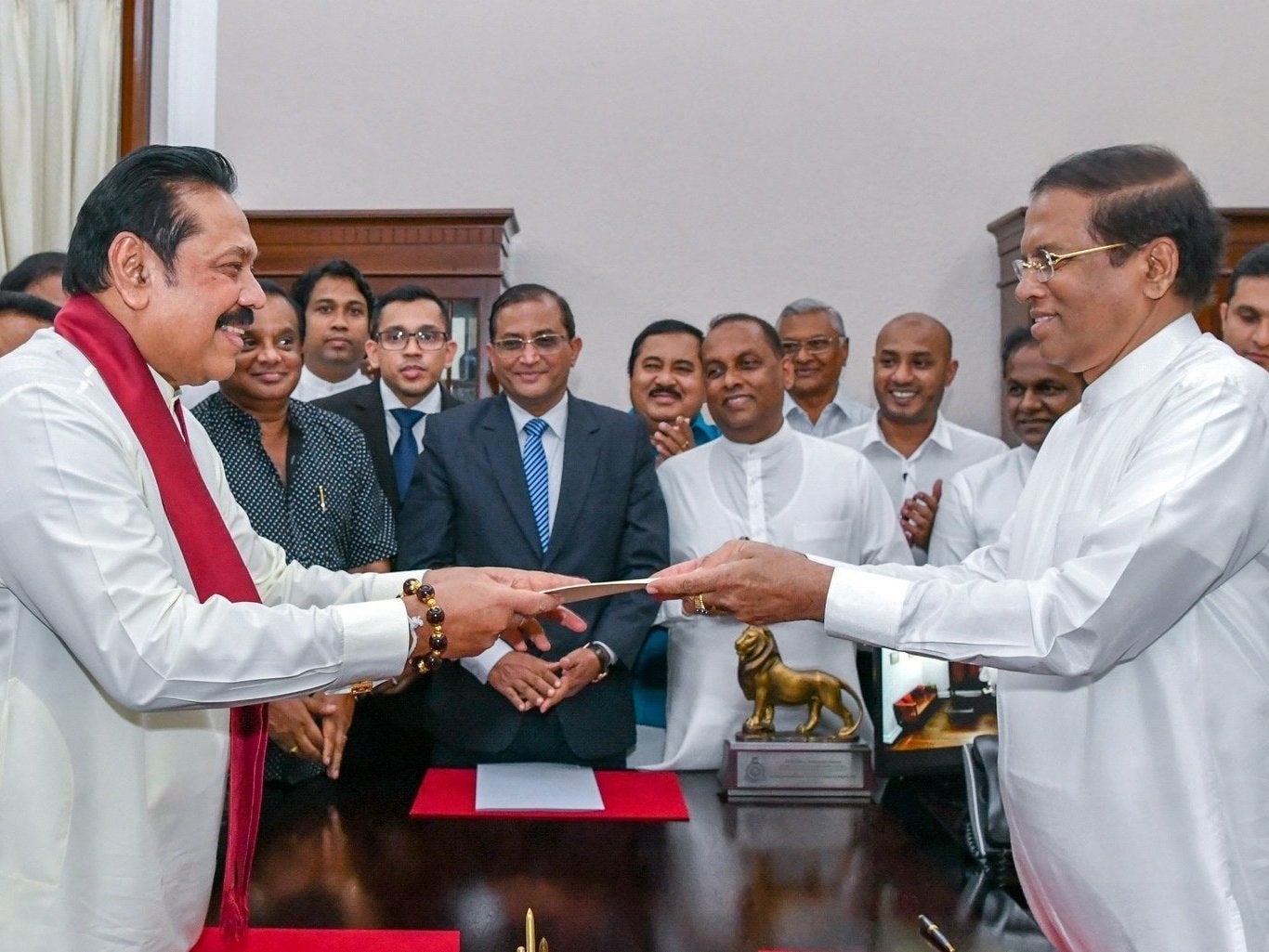 New prime minister Mahinda Rajapaksa (left) sworn in by President Maithripala Sirisena