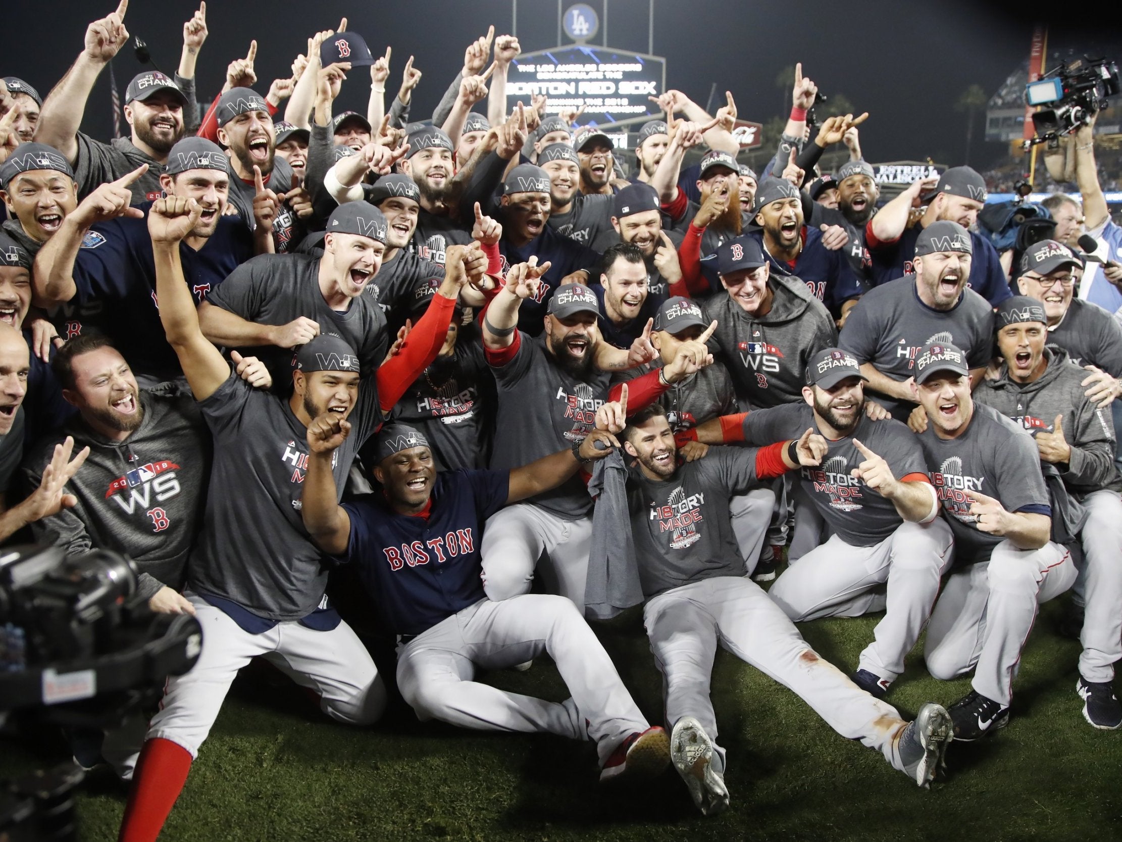 Boston Red Sox players celebrate after winning the World Series