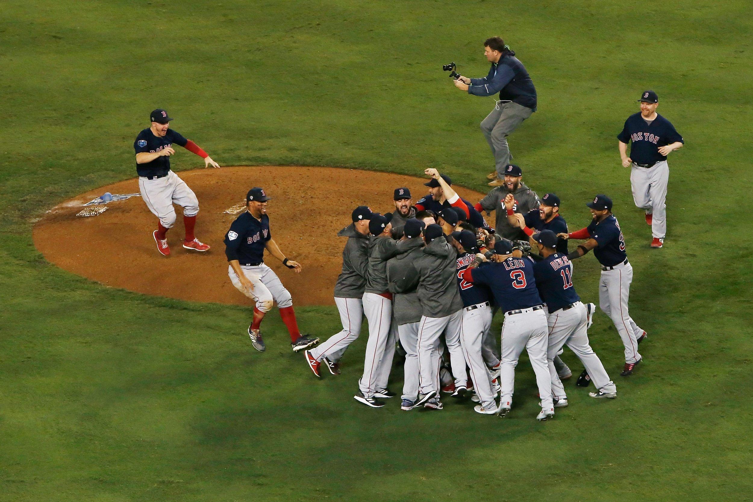 The Boston Red Sox celebrate after sealing the victory