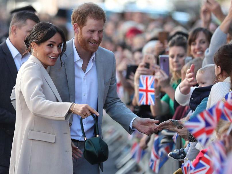 Meghan Markle wore a green satin bag by the same designer during a recent trip to Sussex