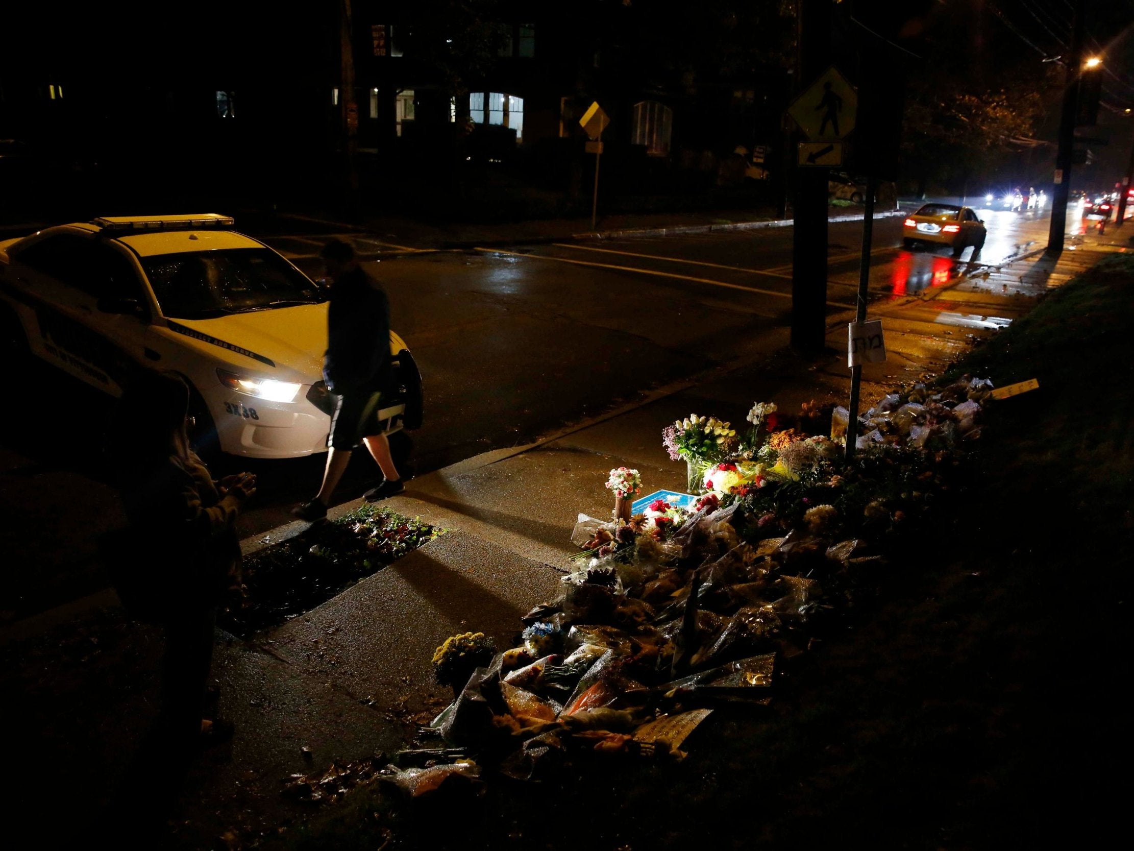 Mourners visit a makeshift memorial outside the Tree of Life synagogue