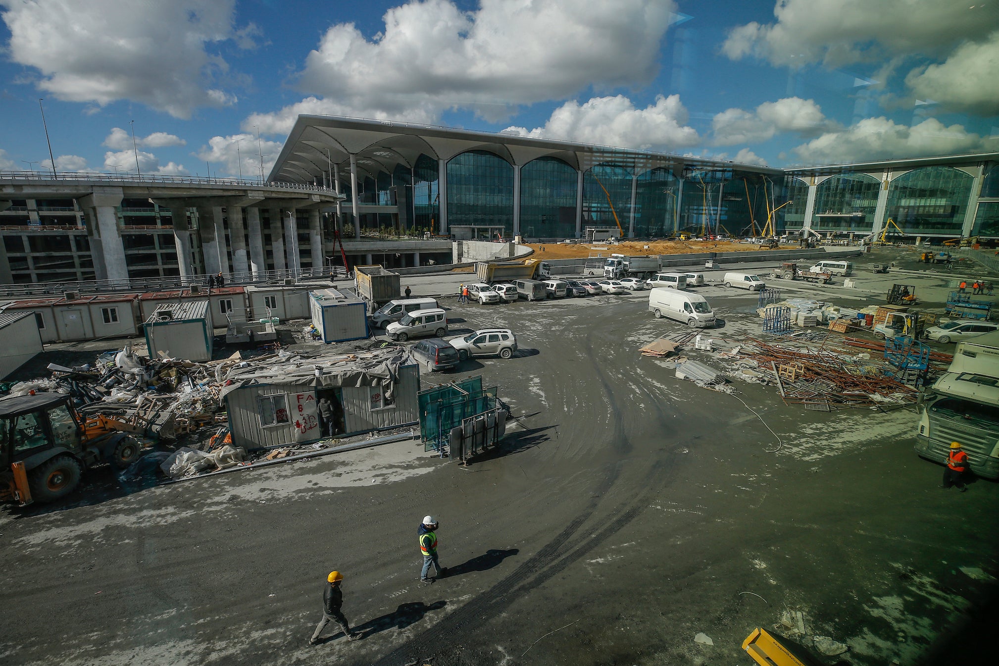 Construction workers at Istanbul's new airport, during a media day Thursday, Oct. 25, 2018, ahead of its opening.