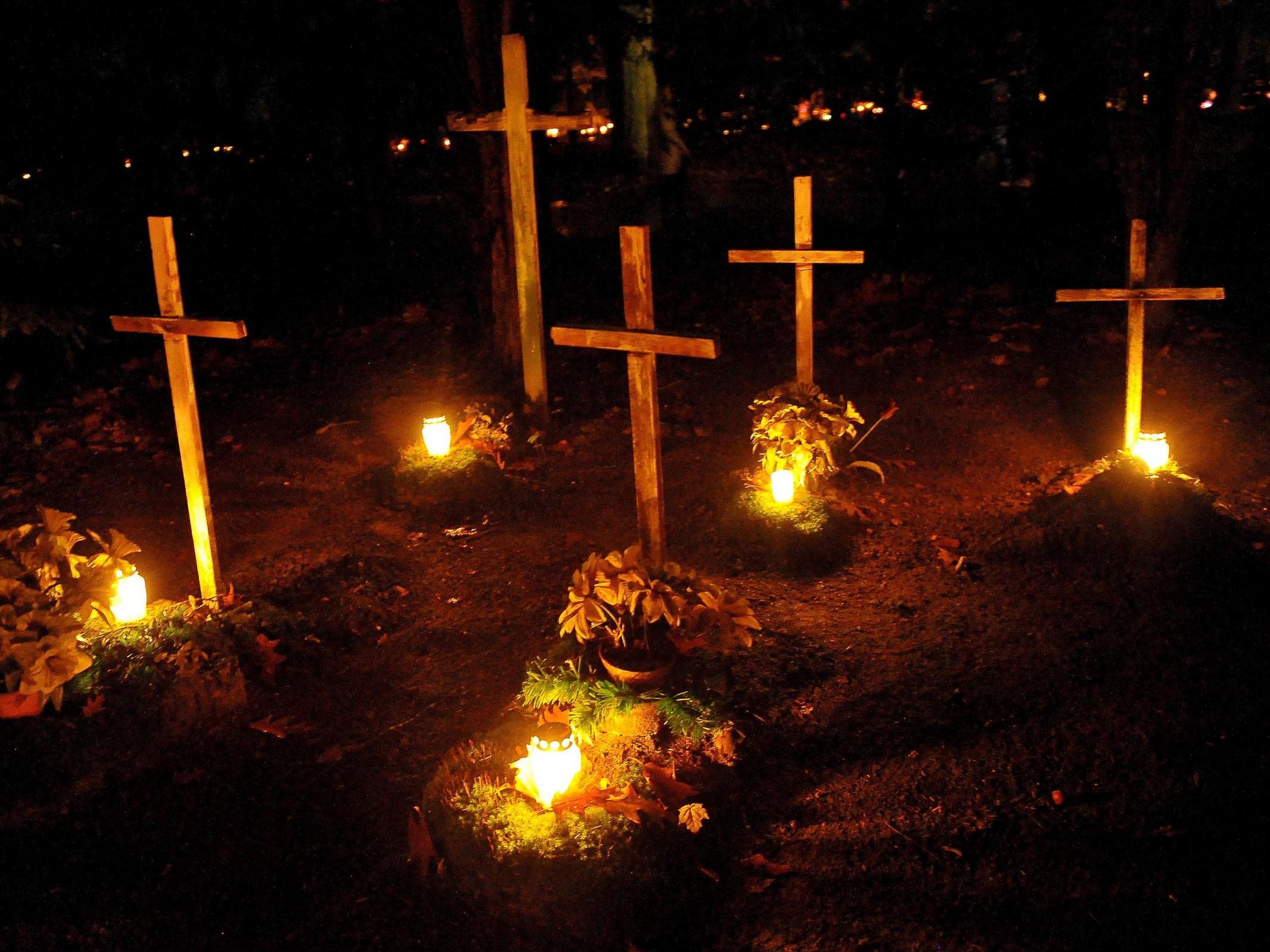 Candles burn on All Saints' Day at the Central Cemetery in Szczecin, Poland