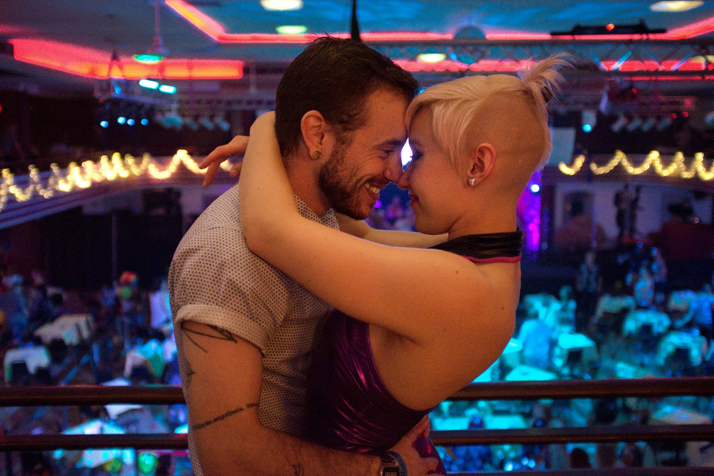 Massie and his fiancee embrace at a Pride party at Casa Loma Ballroom in St Louis