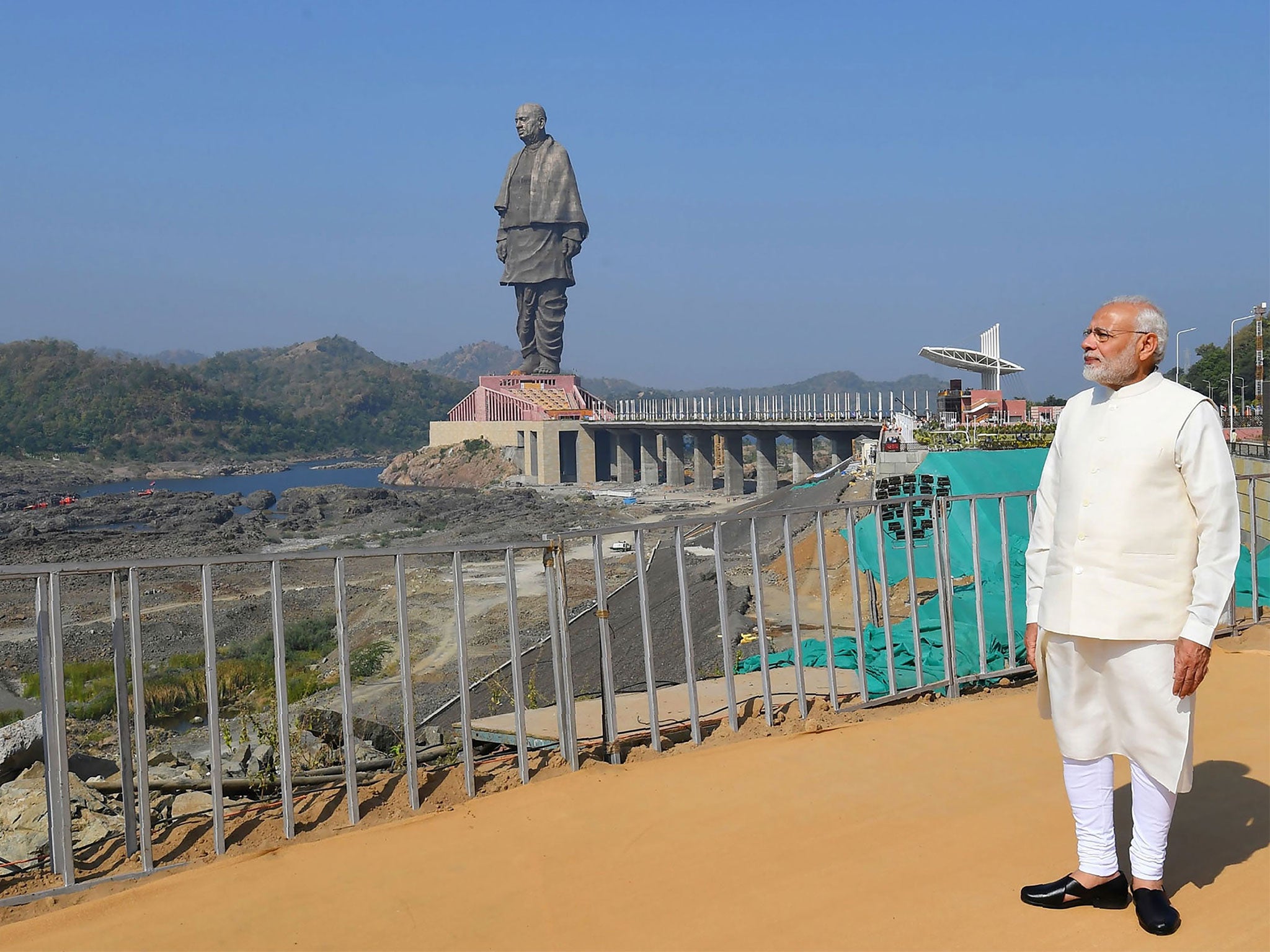 Mr Modi today – he is under fire for dismantling the honoured politicians’ legacy