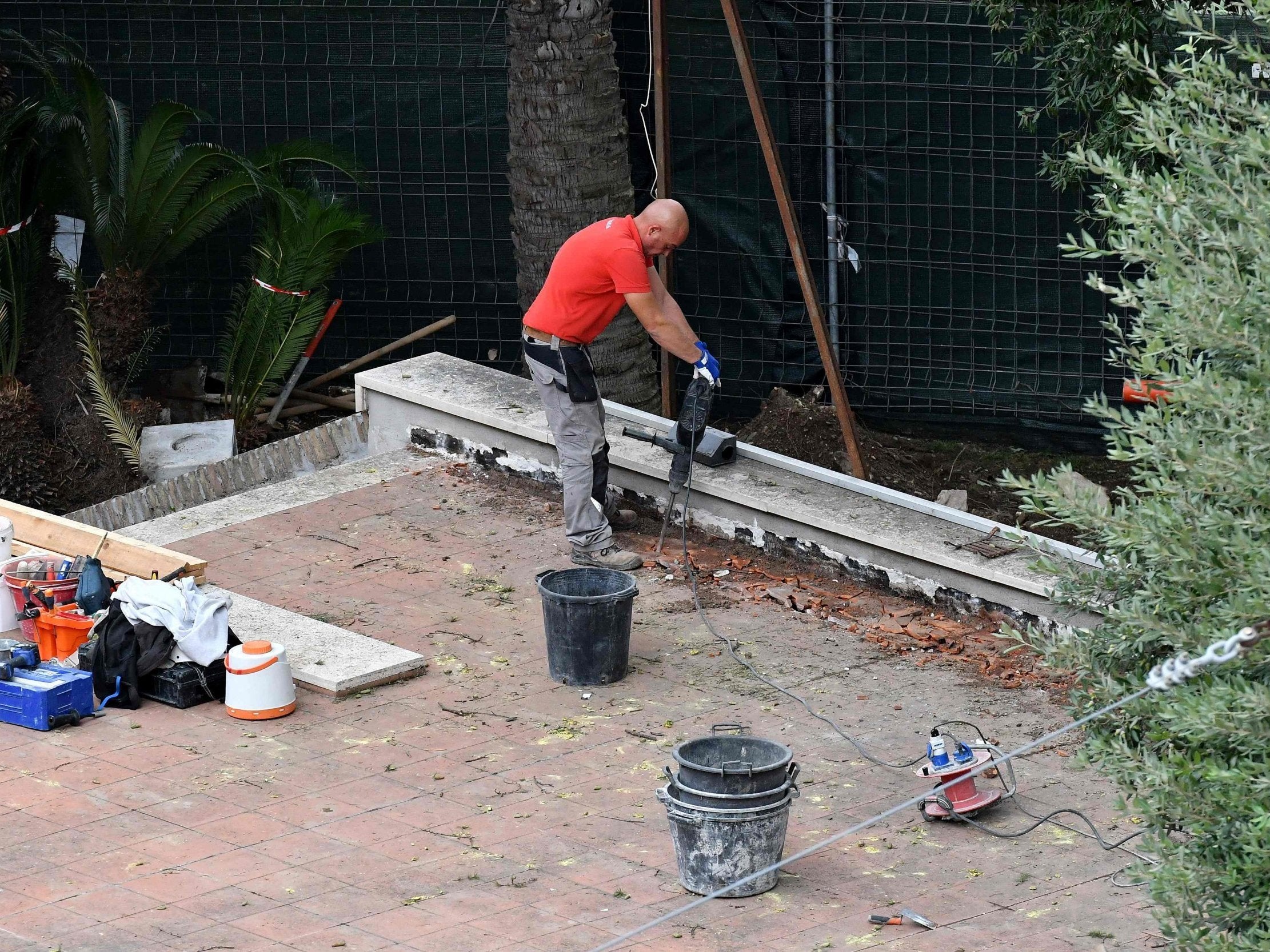 A worker is pictured inside the Vatican embassy to Italy in Rome (Getty)