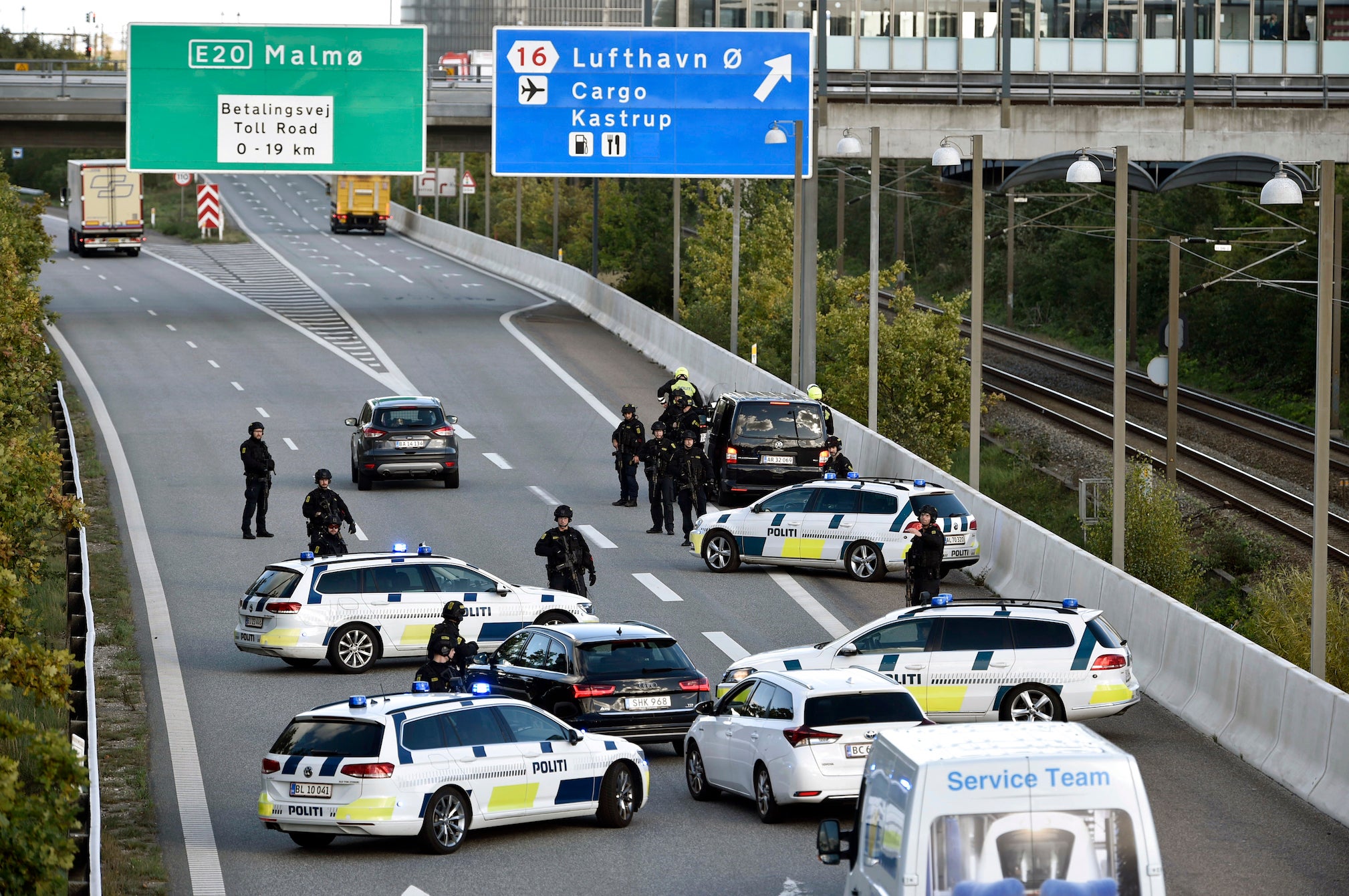 Police surround a suspect on the Oeresund Bridge near Copenhagen on Sunday