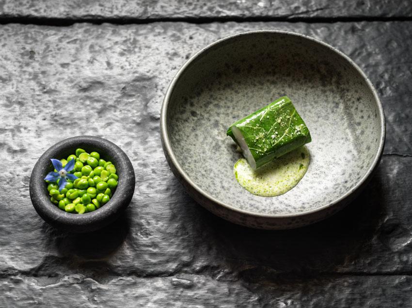 The multi-course menu features dishes like this steamed turbot with horseradish, peas and broad beans