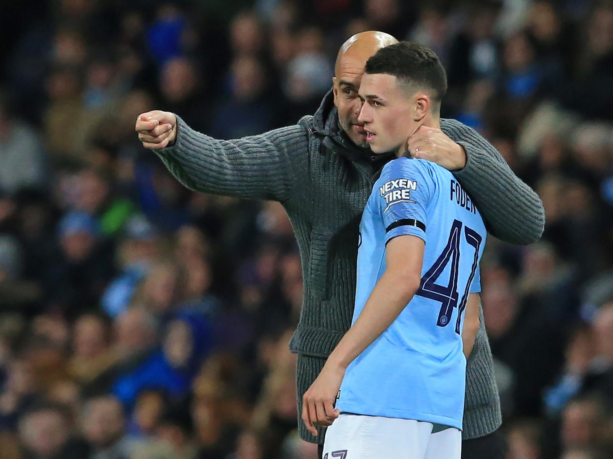 Pep Guardiola whispers instructions to youngster Phil Foden