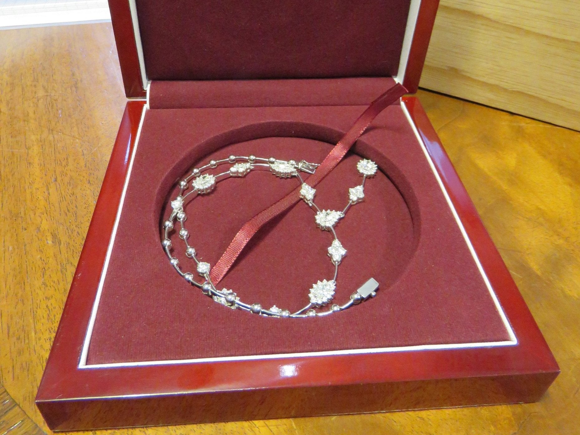 A diamond cluster and bar necklace was among 49 jewellery items seized by the National Crime Agency.