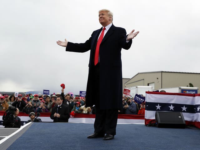 President Donald Trump reacts to the crowd after speaking at a campaign rally in Montana