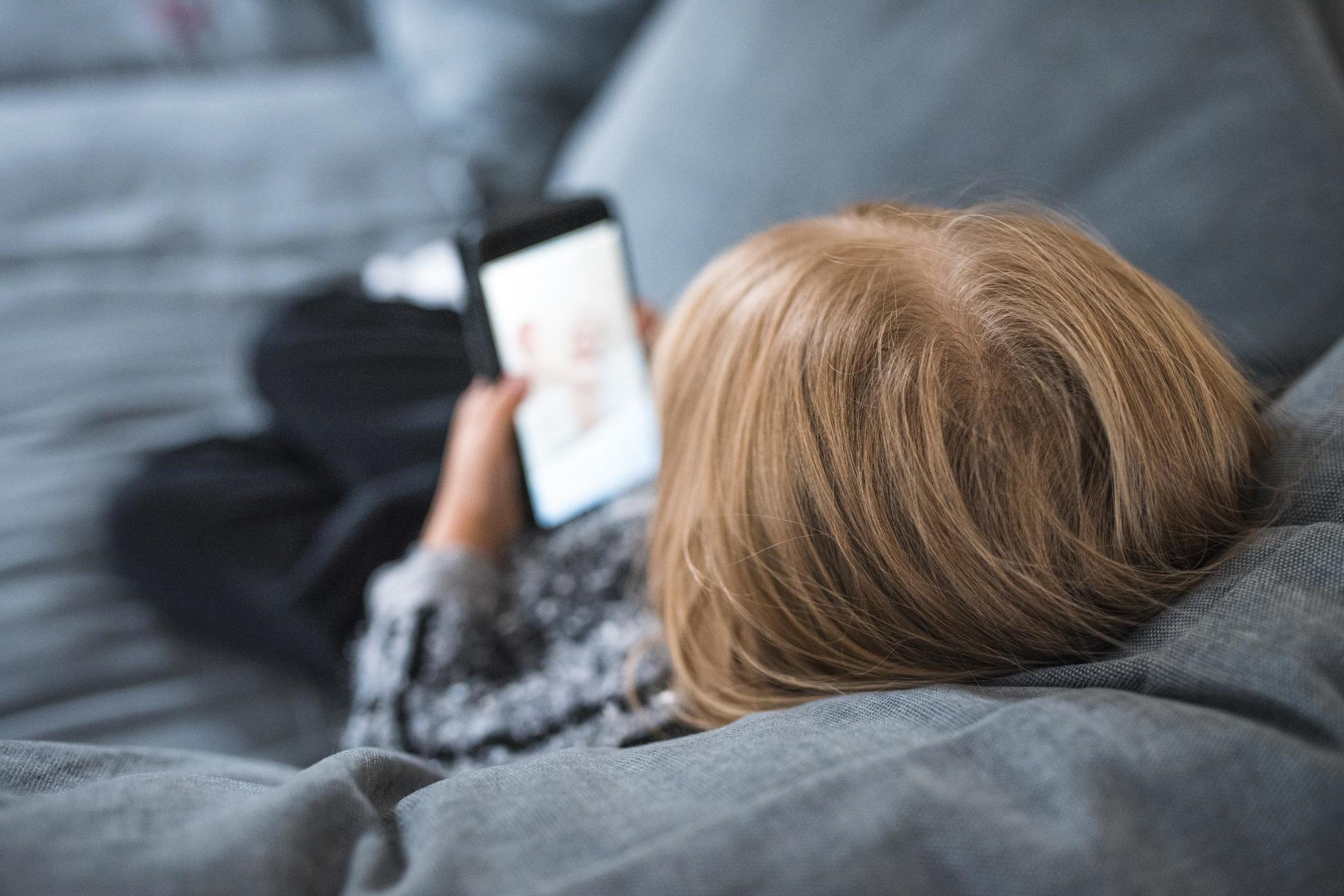 Using smartphones could lead to mental health problems (Getty)