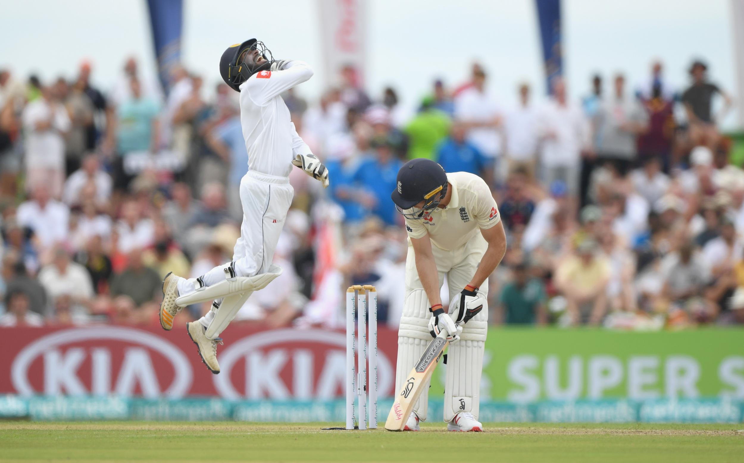 Niroshan Dickwella celebrates taking a brilliant catch to dismiss Jos Buttler