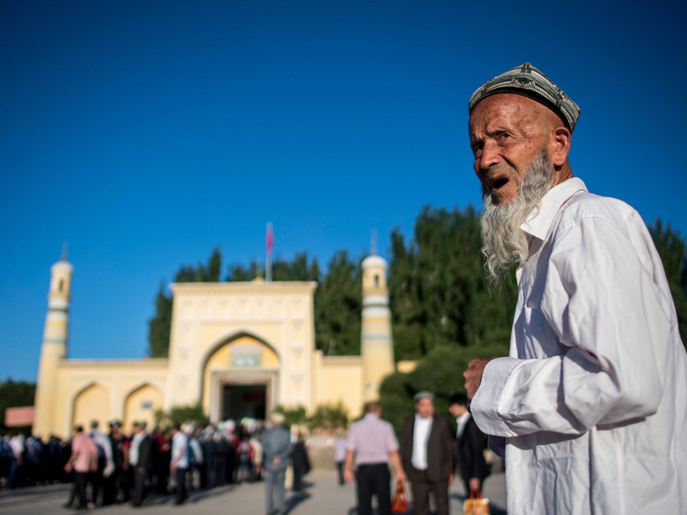 A man arriving in front of the Id Kah Mosque for the morning prayer on Eid al-Fitr in the old town of Kashgar in China's Xinjiang Uighur Autonomus Region