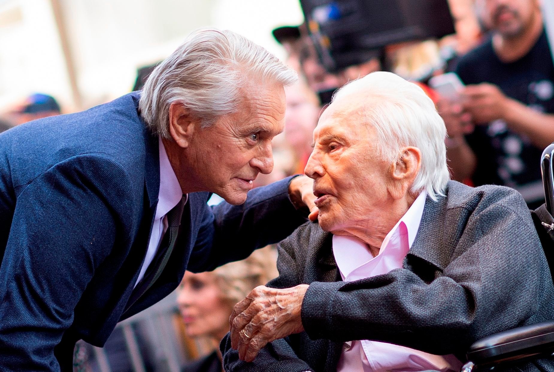 Actor Kirk Douglas (R) attends a ceremony honouring his son actor Michael Douglas (L) with a Star on the Hollywood Walk of Fame in Hollywood, California