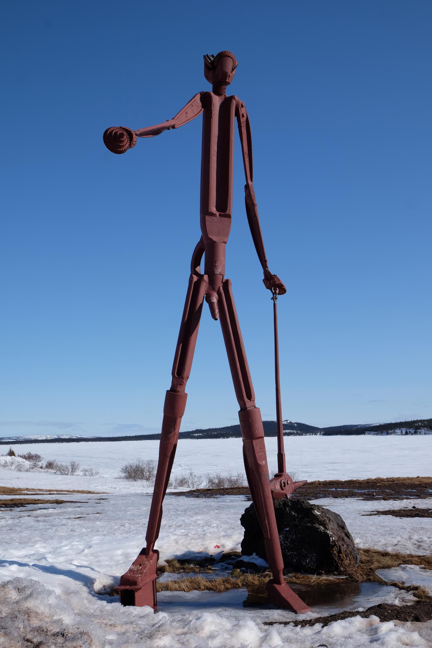 A statue on the shore of Knob Lake